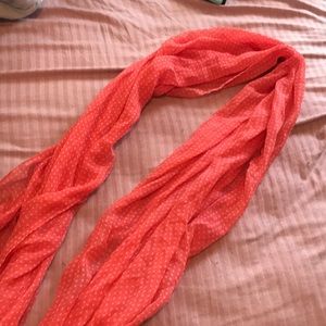 Orange scarf with white polka dots